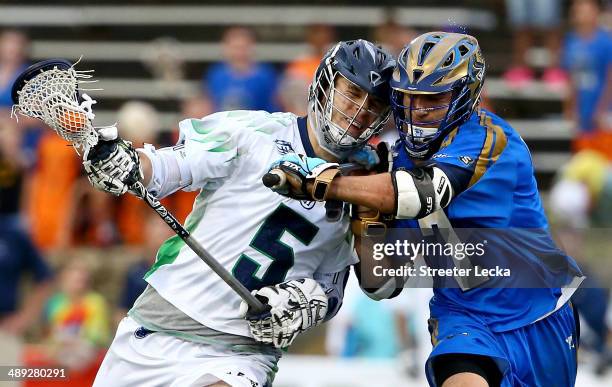 Kyle Dixon of the Chesapeake Bayhawks runs into Jake Tripuka of the Charlotte Hounds during their game at American Legion Memorial Stadium on May 10,...