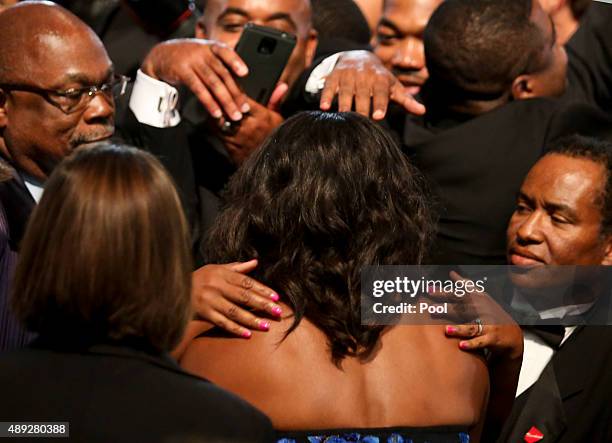 First Lady Michelle Obama greets the crowd after US President Barack Obama delivered remarks at the Congressional Black Caucus Foundations 45th...