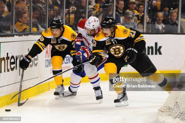 Andrei Markov of the Montreal Canadiens fights for the puck against Matt Fraser and Loui Eriksson of the Boston Bruins in Game Five of the Second...