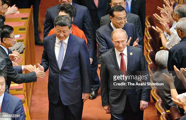 Chinese President Xi Jinping and Russian President Vladimir Putin attend a reception commemorating the 70th Anniversary of the Victory of the Chinese...