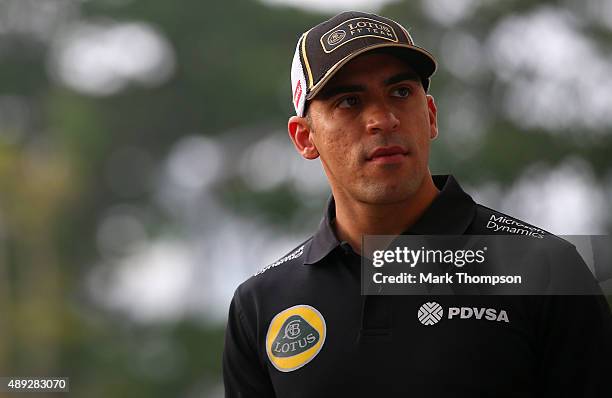 Pastor Maldonado of Venezuela and Lotus walks in the paddock before the Formula One Grand Prix of Singapore at Marina Bay Street Circuit on September...