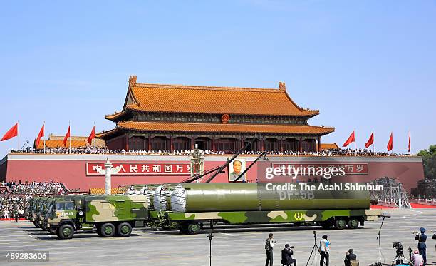 Drive past the Tiananmen Square during a military parade on September 3, 2015 in Beijing, China. China is marking the 70th anniversary of the end of...