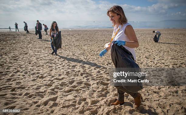 Liberal Democrats supporters take part in a beach clean on the second day of the Liberal Democrats annual conference on September 20, 2015 in...