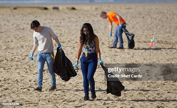 Liberal Democrats supporters take part in a beach clean on the second day of the Liberal Democrats annual conference on September 20, 2015 in...