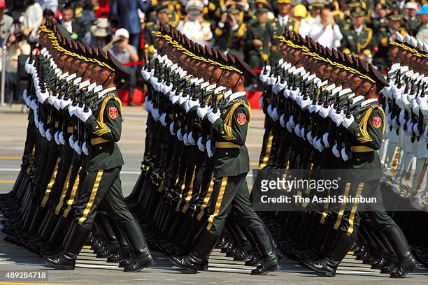 Chinese soldiers march in formation at Tiananmen Square during a military parade on September 3, 2015 in Beijing, China. China is marking the 70th...