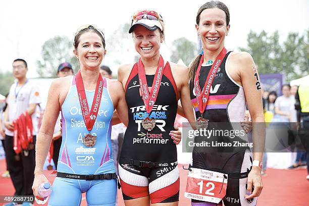 Felicity Sheedy-Ryan of Australia, Lauren Goss of United States and Radka Vodickova of the Czech celebrate after winning the Women's professional...