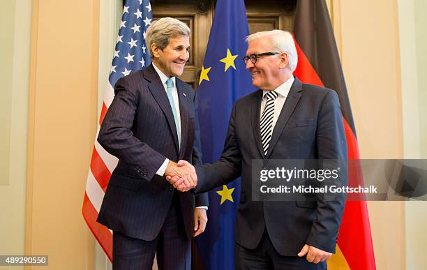 German Foreign Minister Frank-Walter Steinmeier and US Secretary of State John Kerry meet in Villa Borsig for a bilateral talk on September 20, 2015...