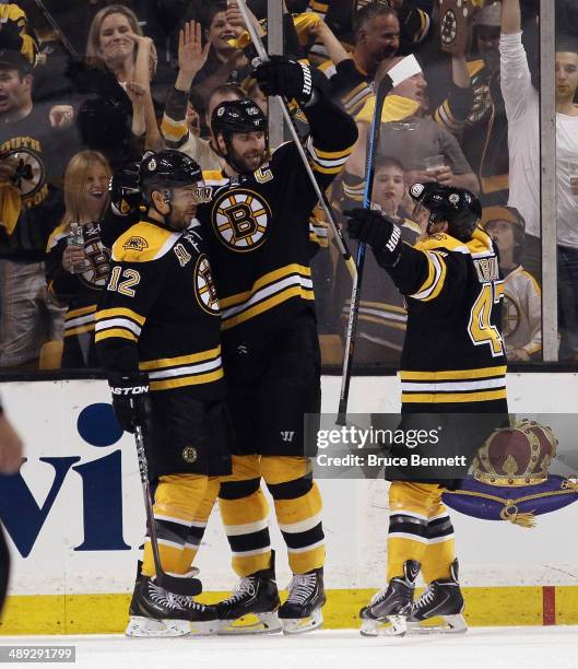 The Boston Bruins celebrate a powerplay goal by Jarome Iginla at 1:36 of the second period against the Montreal Canadiens during Game Five of the...