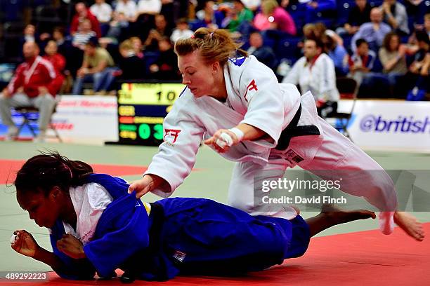 Kelly Edwards of Great Britain chases Issoumaila Aurelia of France to the mat before holding her for ippon on her way to the u52kg gold medal during...