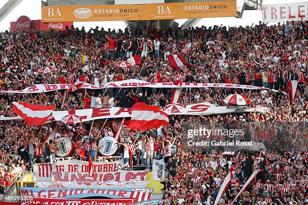 Fans of Estudiantes cheer for their team before the match between Estudiantes and San Lorenzo as part of Torneo Final 2014 at Ciudad de La Plata...