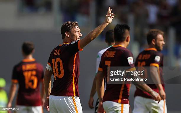 Francesco Totti celebrates with his teammates of AS Roma celebrates after scoring their first goal during the Serie A match between AS Roma and US...