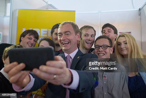 Leader of the Liberal Democrats Tim Farron takes a selfie photograph with young Liberals on the second day of the Liberal Democrats annual conference...