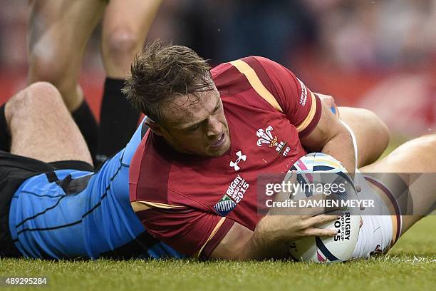 Wales' centre Cory Allen scores his first and Wale's second try during the Pool A match of the 2015 Rugby World Cup between Wales and Uruguay at the...