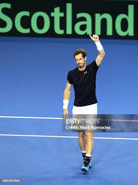 Andy Murray of Great Britain celebrates winning his singles match against Bernard Tomic of Australia taking Great Britain into the Davis Cup Final,...