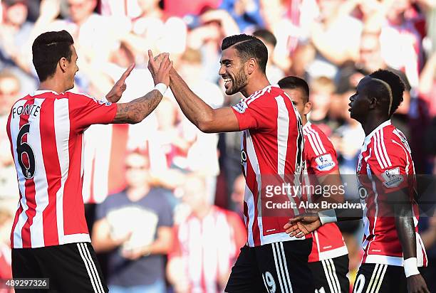 Graziano Pelle of Southampton celebrates with team mates as he scores their first goal during the Barclays Premier League match between Southampton...