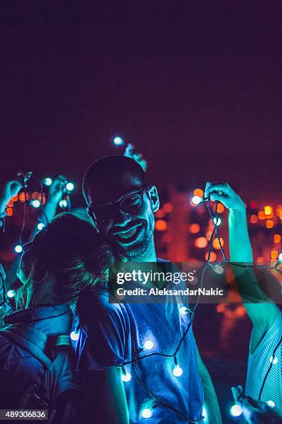 love generation - rooftop party night stock pictures, royalty-free photos & images