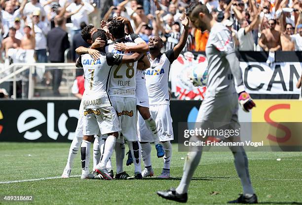 Jadson of Corinthians celebrates scoring the first goal with his team during the match between Corinthians and Santos for the Brazilian Series A 2015...