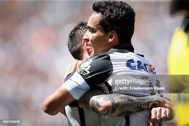 Jadson of Corinthians celebrates scoring the second goal during the match between Corinthians and Santos for the Brazilian Series A 2015 at Arena...