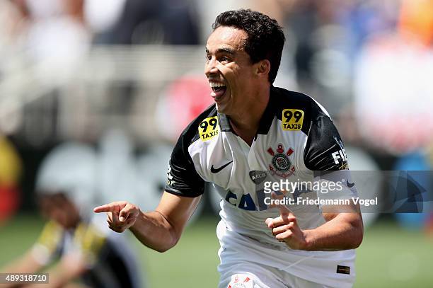 Jadson of Corinthians celebrates scoring the second goal during the match between Corinthians and Santos for the Brazilian Series A 2015 at Arena...