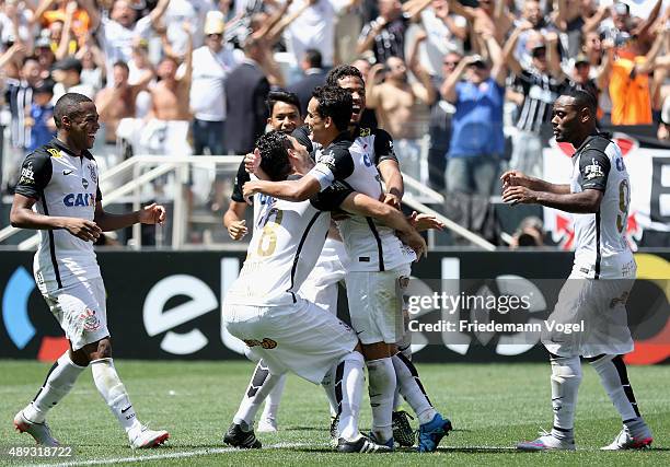 Jadson of Corinthians celebrates scoring the first goal with his team during the match between Corinthians and Santos for the Brazilian Series A 2015...