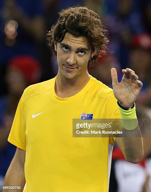 Thanasi Kokkinakis of Australia celebrates his victory over Dan Evens of Great Britain during his singles match on the third day of the Davis Cup...