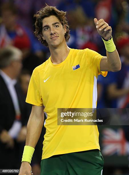 Thanasi Kokkinakis of Australia celebrates his victory over Dan Evens of Great Britain during his singles match on the third day of the Davis Cup...