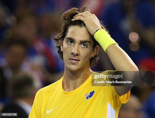 Thanasi Kokkinakis of Australia celebrates his victory over Dan Evens of Great Britain during his singles match on the third day of the Davis Cup...