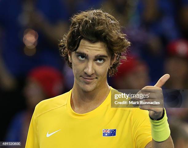 Thanasi Kokkinakis of Australia celebrates his victory over Dan Evens of Great Britain during his singles match on the third day of the Davis Cup...