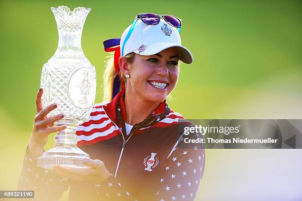 Paula Creamer of the Unitedt States Team shows the trophy after the closing ceremony at the 2015 Solheim Cup at St Leon-Rot Golf Club on September...