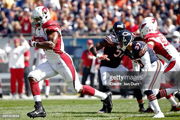 David Johnson of the Arizona Cardinals returns the opening kickoff for a touchdown against the Chicago Bears during the first quarter at Soldier...