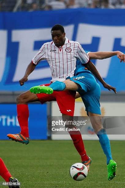 Chuma Anene of FC Amkar Perm vies for the ball with Nicolas Lombaerts of FC Zenit St. Petersburg during the Russian Football Premier League match...