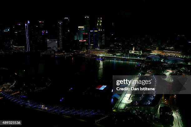 Daniel Ricciardo of Australia and Infiniti Red Bull Racing leads Kimi Raikkonen of Finland and Ferrari and Daniil Kvyat of Russia and Infiniti Red...