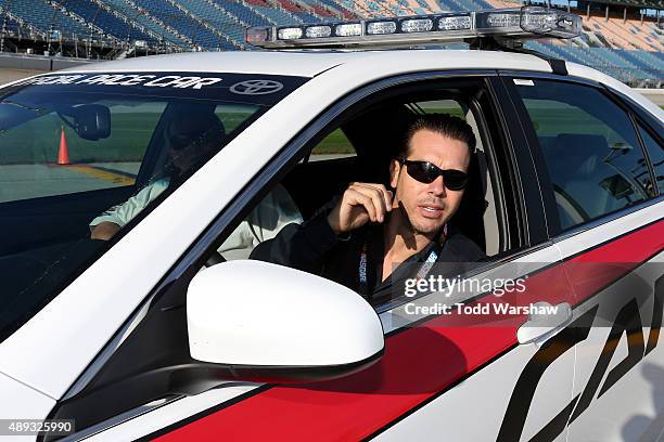 Actor Jon Seda of the tv show Chicago P.D. Sits in the pace car prior to the NASCAR Sprint Cup Series myAFibRisk.com 400 at Chicagoland Speedway on...