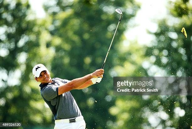 Jason Day of Australia plays a shot on the first hole during the Final Round of the BMW Championship at Conway Farms Golf Club on September 20, 2015...