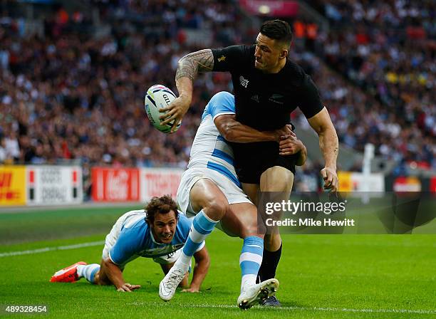 Sonny Bill Williams of New Zealand offloads in the tackle during the 2015 Rugby World Cup Pool C match between New Zealand and Argentina at Wembley...