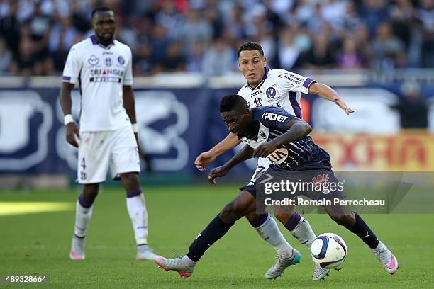Adrien Regattin for Toulouse FC and Andre Biyogo Poko for FC Girondins de Bordeaux battle for the ball during the French Ligue 1 game between FC...