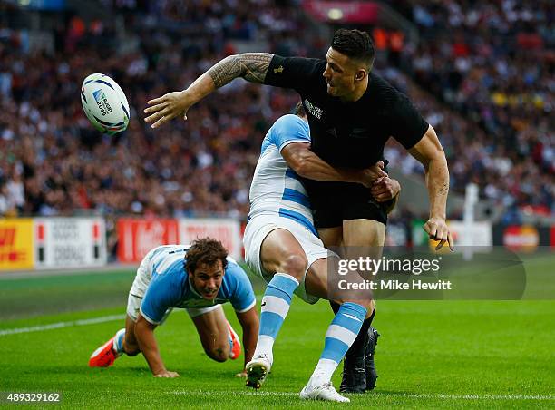 Sonny Bill Williams of New Zealand offloads in the tackle during the 2015 Rugby World Cup Pool C match between New Zealand and Argentina at Wembley...