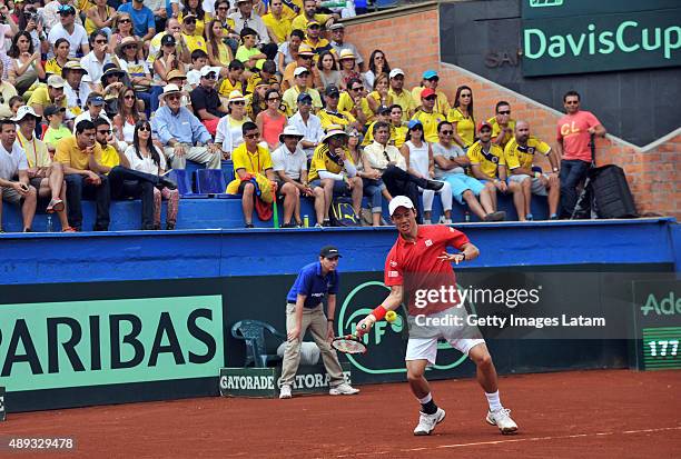 Kei Nishikori of Japan returns a forehand shot during the Davis Cup World Group Play-off singles match between Santiago Giraldo of Colombia and Kei...