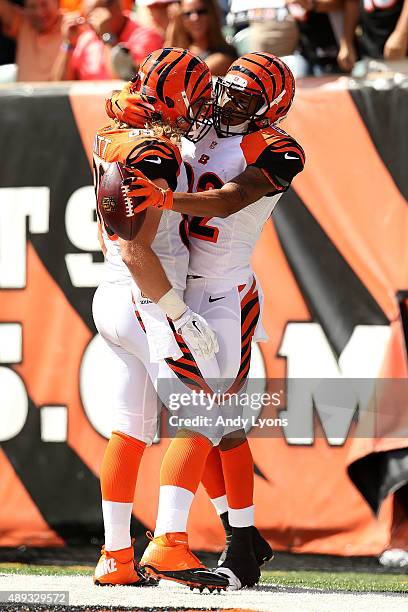 Marvin Jones of the Cincinnati Bengals is congratulated by Ryan Hewitt of the Cincinnati Bengals after scoring a touchdown during the second quarter...