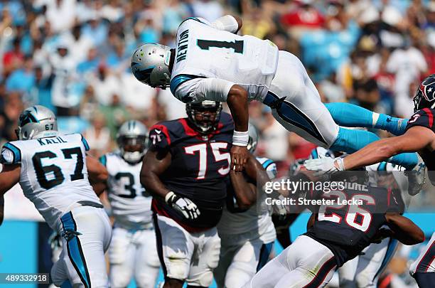Cam Newton of the Carolina Panthers dives for a touchdown against the Houston Texans during their game at Bank of America Stadium on September 20,...