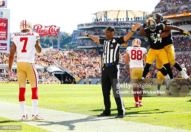 Cameron Heyward and Lawrence Timmons of the Pittsburgh Steelers celebrate following an incomplete pass ruling in front of Colin Kaepernick of the San...