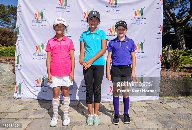 Girls 10-11 age group 1st Place winner Leigh Chien, 3rd place Eva Pett and 2nd place Kelly XU pose during their medal ceremony at The Drive, Chip and...