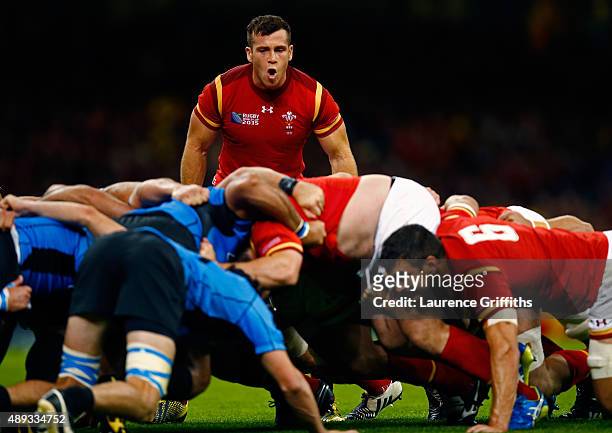 Gareth Davies of Wales gives instructions to the scrum during the 2015 Rugby World Cup Pool A match between Wales and Uruguay at the Millennium...