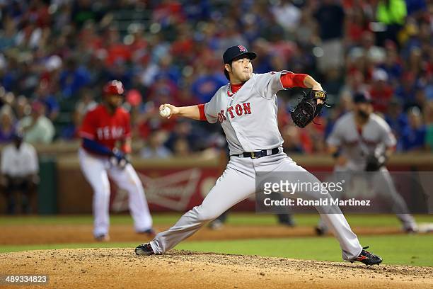Junichi Tazawa of the Boston Red Sox throws against the Texas Rangers in the 8th inning at Globe Life Park in Arlington on May 10, 2014 in Arlington,...