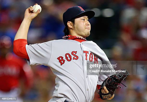 Junichi Tazawa of the Boston Red Sox throws against the Texas Rangers in the 8th inning at Globe Life Park in Arlington on May 10, 2014 in Arlington,...