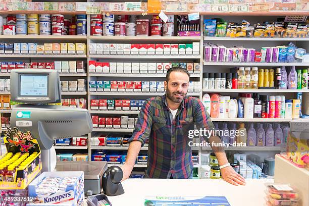 shop owner portrait - migrant worker stockfoto's en -beelden