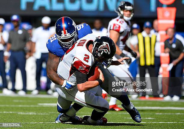 Matt Ryan of the Atlanta Falcons is sacked by Robert Ayers of the New York Giants in the fourth quarter at MetLife Stadium on September 20, 2015 in...