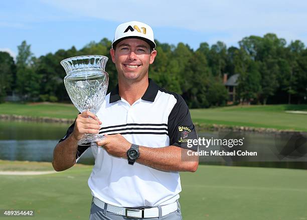 Chez Reavie holds the trophy after winning the Small Business Connection Championship at River Run held at River Run Country Club on September 20,...