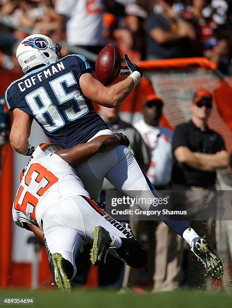 Chase Coffman of the Tennessee Titans makes a fourth quarter catch while being tackled by Craig Robertson of the Cleveland Browns at FirstEnergy...