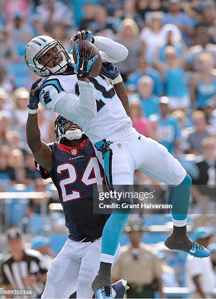 Corey Brown of the Carolina Panthers scores a touchdown against Johnathan Joseph of the Houston Texans during their game at Bank of America Stadium...